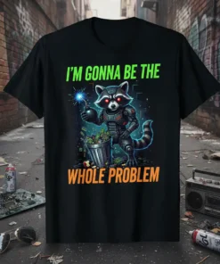 Black t-shirt with "I'M GONNA BE THE WHOLE PROBLEM" text and a cyborg raccoon holding a bomb, surrounded by money