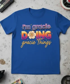 I'm Gracie Doing Gracie Things quote on a blue t-shirt with colorful retro typography and a floral graphic