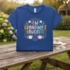 I'm Grandma's Favorite text design with floral accents on a blue t-shirt