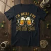 I'm Here For For The Booz text design with two frothy beer mugs and hop accents on a dark t-shirt