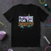 I'm Here For The Party text graphic with neon-style lettering and colorful soundwave design on a black t-shirt