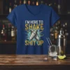 T-shirt with the quote "I'm Here To Shake Shit Up" and crossed cocktail shakers graphic in gold and blue