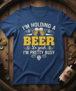 Funny "I'm Holding A Beer So Yeah, I'm Pretty Busy" quote t-shirt design with beer mugs graphic