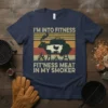 I'm Into Fitness Fit'ness Meat In My Smoker quote on a navy t-shirt with a vintage graphic of a smoker