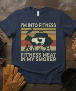 I'm Into Fitness Fit'ness Meat In My Smoker quote on a navy t-shirt with a vintage graphic of a smoker