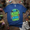 I'm Jesse Doing Jesse Things graffiti style text on a blue t-shirt with abstract colorful background and city skyline graphic