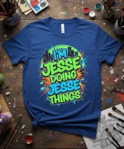I'm Jesse Doing Jesse Things graffiti style text on a blue t-shirt with abstract colorful background and city skyline graphic