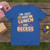 I'm Just Here For Lunch And Recess quote with burger, apple, and swing set graphic on a blue t-shirt