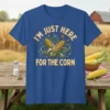 I'm Just Here For The Corn text with corn cobs and butterflies graphic on a blue t-shirt
