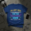 Blue t-shirt with yellow, white, purple, and teal text reading "I'm Just Here For The Halftime Show" with musical notes
