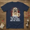 I'm Just Here For The Hugs And The Treats quote on a navy t-shirt with a mastiff dog holding a
