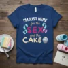 Navy blue t-shirt with white, pink, and tan text reading "I'm Just Here for the Sex and the Cake", featuring
