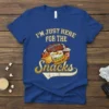 Blue t-shirt with "I'm Just Here For The Snacks" text and football game day food graphics