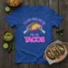 Blue t-shirt with "I'm Just Here For The Tacos" text and a robot holding a taco graphic
