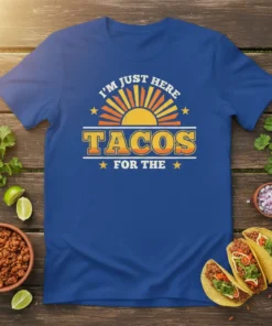 I'm Just Here For The Tacos quote with a retro sun graphic on a royal blue t-shirt