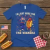 I'm Just Here For The Wieners patriotic t-shirt with cartoon hot dog and soda characters holding an American flag