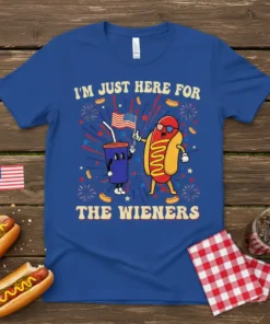 I'm Just Here For The Wieners patriotic t-shirt with cartoon hot dog and soda characters holding an American flag