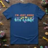 I'm Just Here To Be Eye Candy quote in colorful retro font with candy illustrations on a blue t-shirt