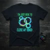 T-shirt with text "I'm Just Here To Close My Rings" and gear graphics, green and cyan neon style