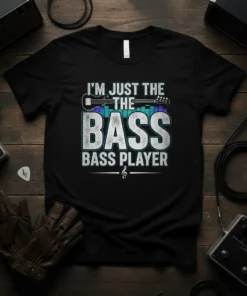 I'm Just The Bass Bass Player quote with electric guitar graphic and equalizer bars on a black t-shirt