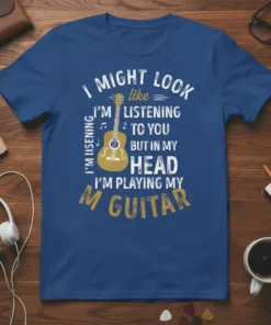Blue t-shirt with white and gold text that reads "I Might Look Like I'm Listening To You But In My