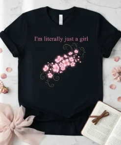 T-shirt with pink text "I'm literally just a girl" above a cluster of pink cherry blossoms and gold accents
