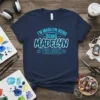 Navy t-shirt with "I'm Madelyn Doing Doing Madelyn Things" in bright blue and white text, featuring playful typography