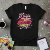 Black t-shirt with colorful text reading "I'M Maggie DOING MAGGIE THINGS Things" in a playful, vibrant design