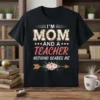 I'm Mom and a Teacher Nothing Scares Me quote on a black t-shirt with floral accents and an arrow graphic