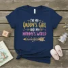 I'm My Daddy's Girl and My Mommy's World text design with a golden arrow graphic, displayed on a navy blue