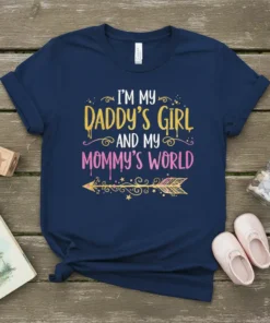 I'm My Daddy's Girl and My Mommy's World text design with a golden arrow graphic, displayed on a navy blue