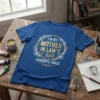 Blue t-shirt with gold and white text that reads "I'm My Mother In Law's Child Favorite Child" within a floral