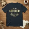 I'M MY MOTHER In-Law's FAVORITE CHILD text in gold and white vintage style typography on a navy blue t-shirt