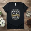 I'm My Mother In-Law's Favorite Child text design on a black t-shirt with decorative border and gold banner