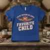 I'm My Mother In Law's Favorite Child text with winged shield graphic on blue t-shirt