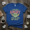 I'm Not Angry This Is Just My Face text with an angry green emoji graphic on a royal blue t-shirt