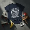 Navy blue t-shirt with white text: "I'm Not Clumsy Just The Floor Hates Me The Table & Chairs Are Bullies