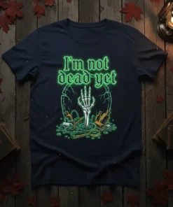 Navy t-shirt with neon green text "I'm not dead yet" and a skeleton hand rising from a cracked grave graphic
