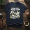 I'm Not Drunk I Am A Stroke Survivor text design on a navy blue t-shirt, featuring stylized typography and decorative