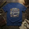 I'm Not Getting Old I'm Becoming A Legend quote on a blue t-shirt, featuring vintage engine parts and typography