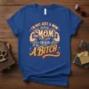 I'm Not Just A Mom Mom I'm Also A Bitch text design with muscular arms graphic on a royal blue