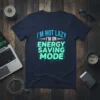 I'm Not Lazy I'm On Energy Saving Mode text design on a navy blue t-shirt, featuring electric blue and teal
