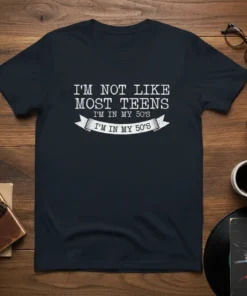 I'm Not Like Most Teens I'm In My 50's quote on a dark t-shirt, featuring retro typography and a banner