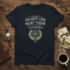 I'm Not Like Most Teens I'm In My 60's quote on a navy t-shirt with compass graphic
