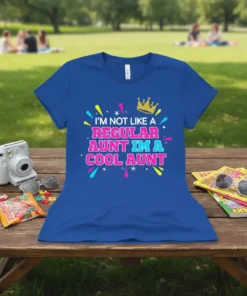 I'm Not Like A Regular Aunt I'm A Cool Aunt text design with crown graphic on a royal blue t-shirt