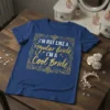 I'm Not Like A Regular Bride I'm A Cool Bride text design on a blue t-shirt, with gold glitter accents