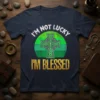 I'm Not Lucky I'm Blessed t-shirt with white text and a green Celtic cross graphic on a striped circle background