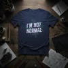 T-shirt with "I'm Not Normal" text in a glitchy, digital circuit board design, dark navy blue