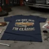 I'm Not Old I'm Classic text with a vintage gold convertible car graphic on a navy blue t-shirt