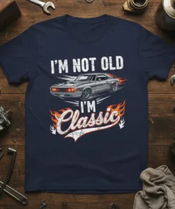 I'm Not Old I'm Classic text with a vintage muscle car graphic and flames on a navy t-shirt
